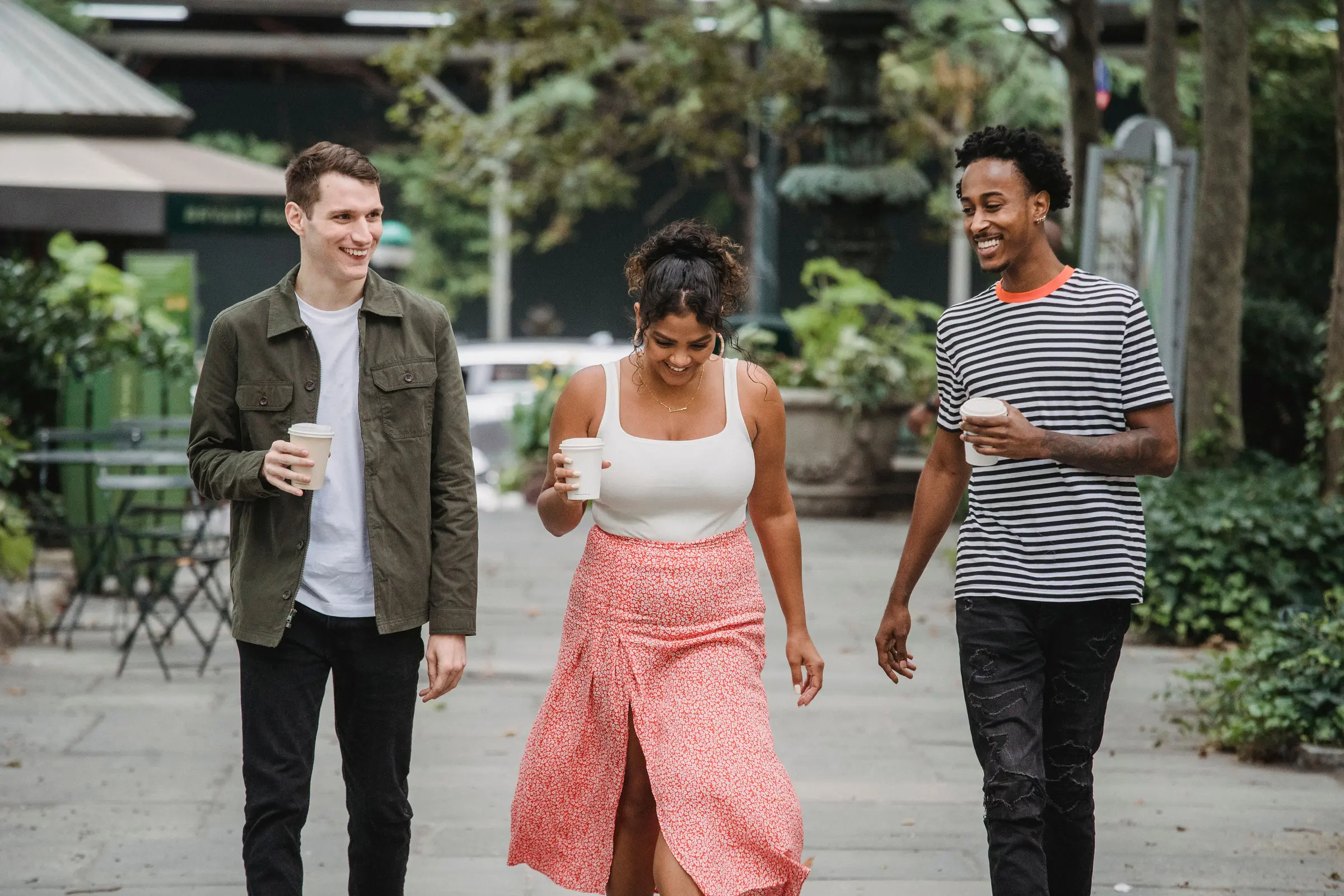 A multicultural group of friends walking together in the community